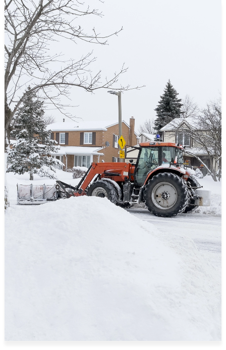 A man driving the snow vehicle to remove the snow